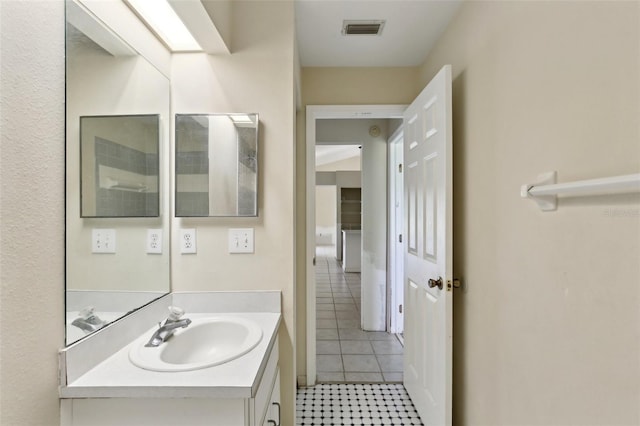 bathroom with visible vents, tile patterned flooring, and vanity