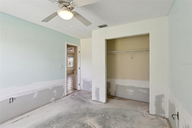 unfurnished bedroom with a ceiling fan, a closet, and visible vents