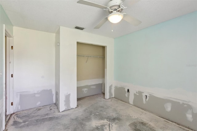 unfurnished bedroom with visible vents, a ceiling fan, and a closet