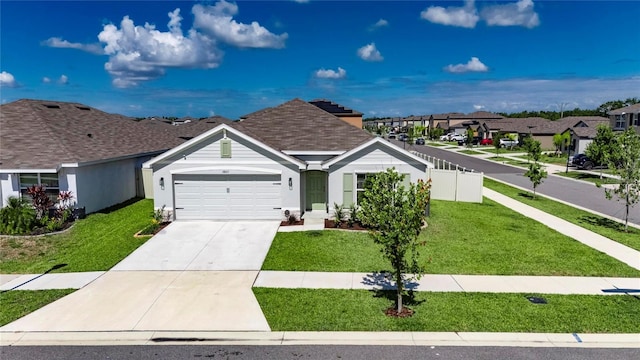 ranch-style home with a residential view, a garage, and concrete driveway