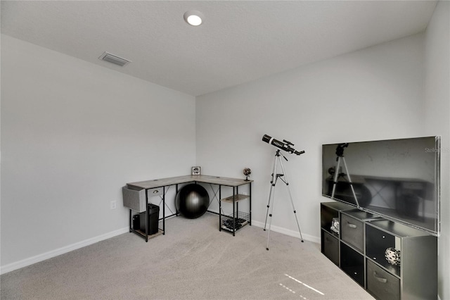 miscellaneous room with carpet floors and baseboards
