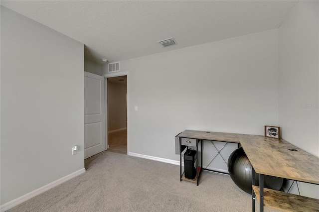 unfurnished office featuring carpet floors and baseboards