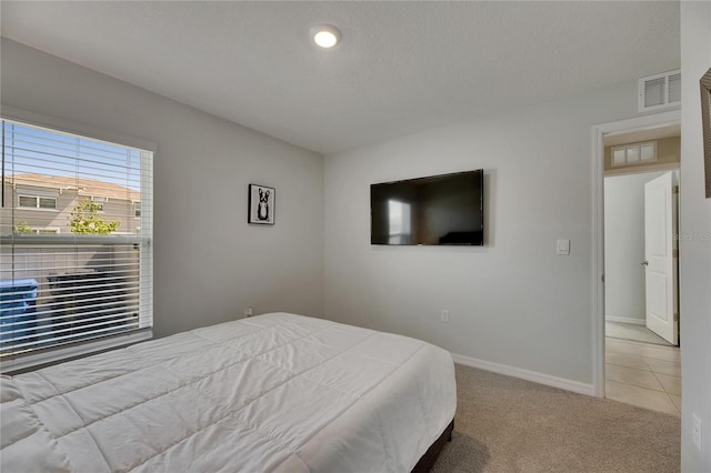 carpeted bedroom with baseboards