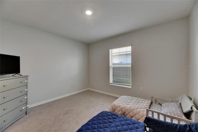living area with light carpet and baseboards