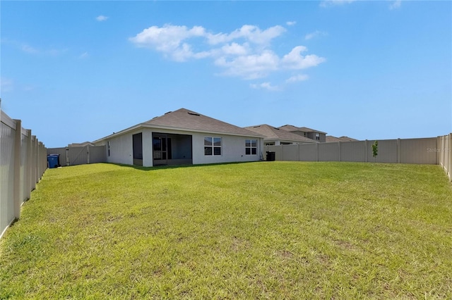 rear view of property featuring stucco siding