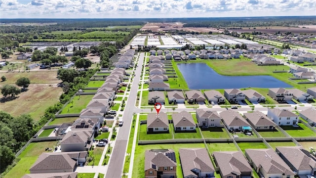 aerial perspective of suburban area featuring a large body of water