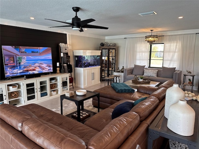 926 Eagle Ln, Apollo Beach, FL 33572 - living room featuring a textured ceiling, visible vents, ornamental molding, and ceiling fan with notable chandelier