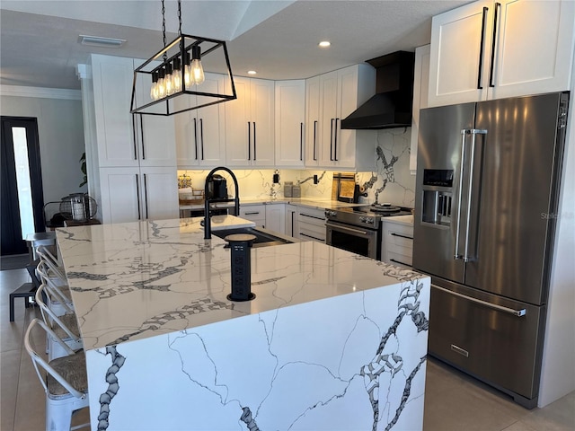 926 Eagle Ln, Apollo Beach, FL 33572 - kitchen featuring crown molding, visible vents, wall chimney exhaust hood, light stone counters, and appliances with stainless steel finishes
