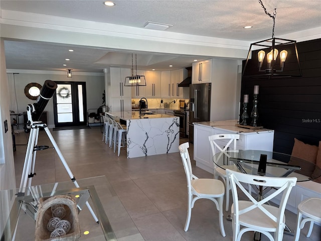 926 Eagle Ln, Apollo Beach, FL 33572 - dining room featuring recessed lighting, a textured ceiling, a chandelier, and tile patterned flooring