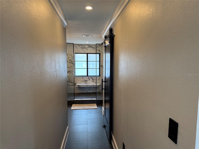 926 Eagle Ln, Apollo Beach, FL 33572 - hall with baseboards, a textured wall, visible vents, and dark tile patterned flooring