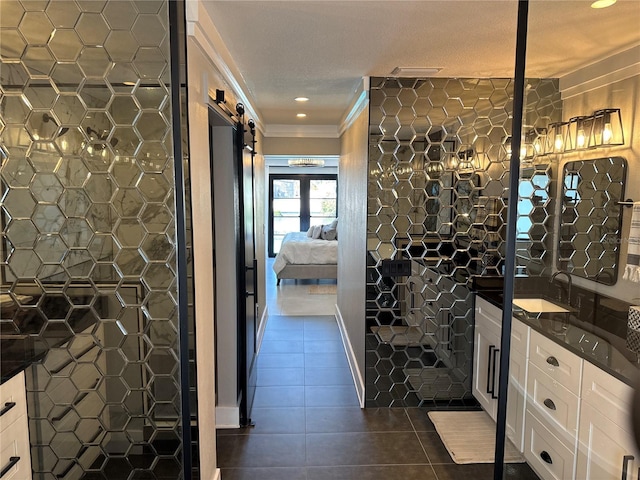 926 Eagle Ln, Apollo Beach, FL 33572 - ensuite bathroom featuring crown molding, tile patterned floors, ensuite bathroom, and vanity