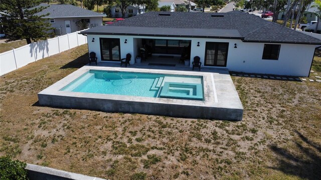 926 Eagle Ln, Apollo Beach, FL 33572 - view of pool featuring a fenced backyard, french doors, a fenced in pool, a lawn, and an in ground hot tub
