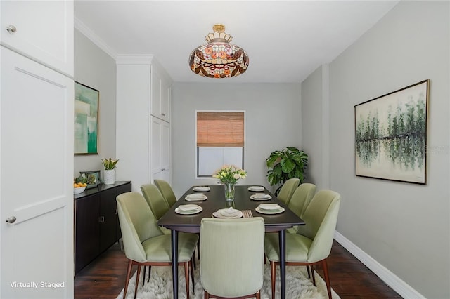dining space with baseboards and dark wood finished floors
