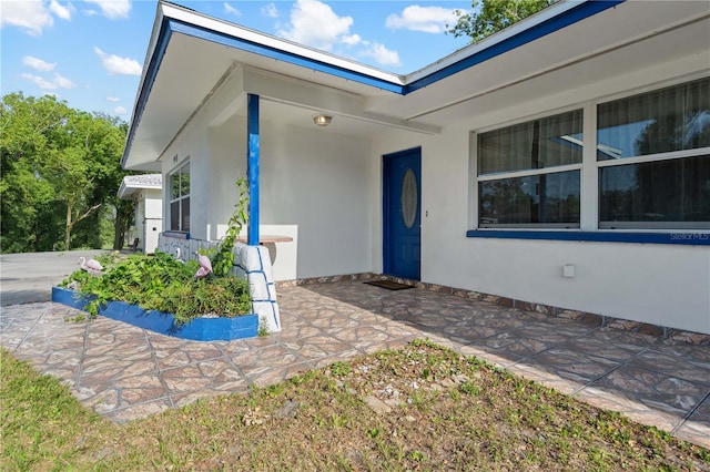 1099 7th Ave NE, Largo, FL 33770 - entrance to property featuring stucco siding