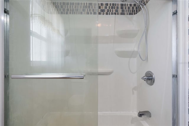 1099 7th Ave NE, Largo, FL 33770 - bathroom with shower / bath combination with glass door