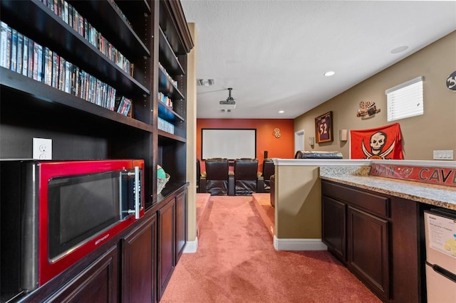 interior space featuring light colored carpet, recessed lighting, baseboards, and visible vents