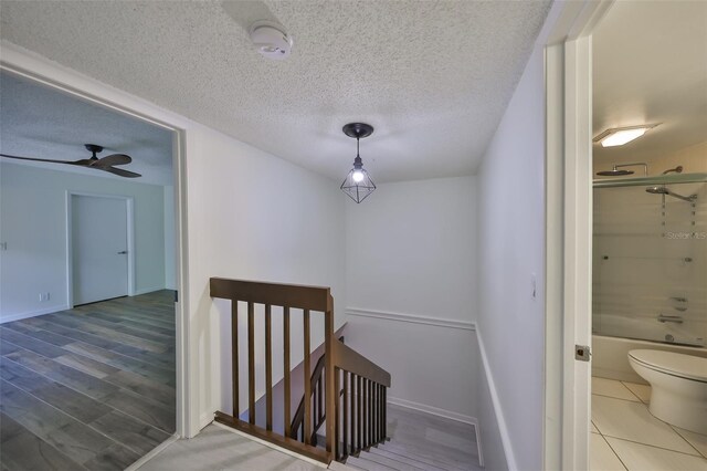 2627 2nd Ct, Palm Harbor, FL 34684 - stairway with baseboards and a textured ceiling