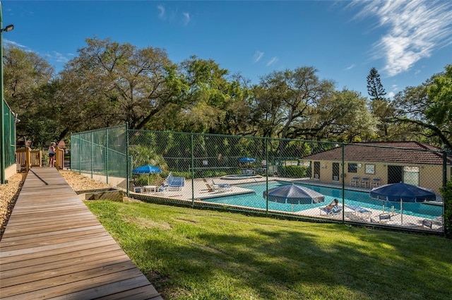 2627 2nd Ct, Palm Harbor, FL 34684 - community pool featuring a patio area, fence, and a yard
