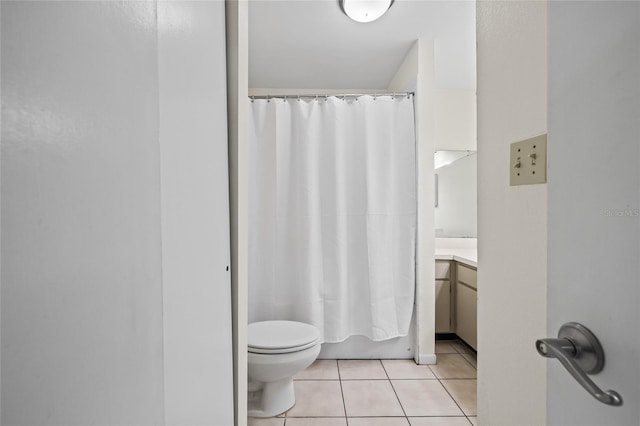 bathroom featuring toilet, shower / bathtub combination with curtain, tile patterned flooring, and vanity
