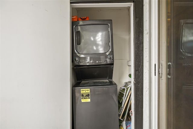laundry area with laundry area and stacked washer and clothes dryer