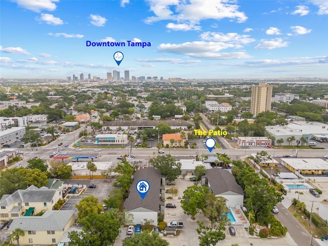 birds eye view of property featuring a city view