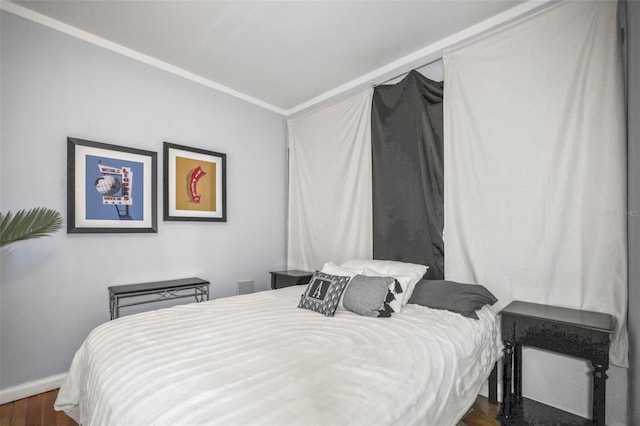 2235 Burlington Ave N, Saint Petersburg, FL 33713 - bedroom with crown molding, baseboards, and dark wood-style floors
