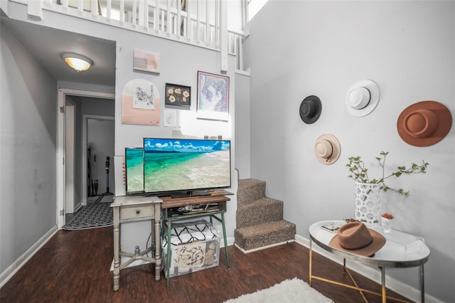 2235 Burlington Ave N, Saint Petersburg, FL 33713 - living room featuring baseboards, a high ceiling, stairs, and wood finished floors