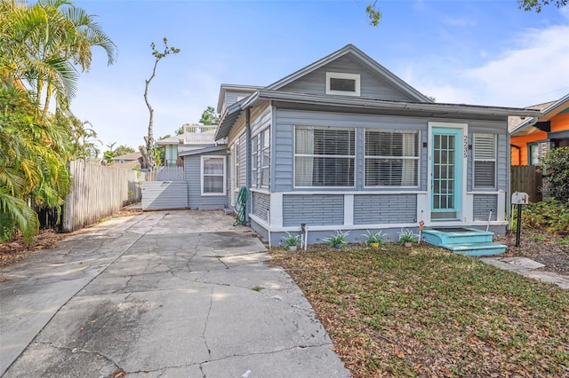2235 Burlington Ave N, Saint Petersburg, FL 33713 - view of front of house with fence and concrete driveway