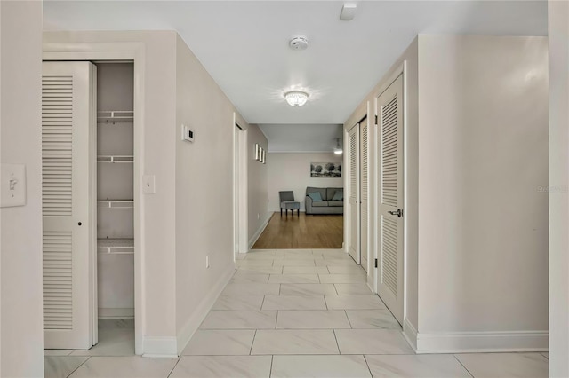 4175 Northmeadow Cir Unit 4175, Tampa, FL 33618 - corridor with baseboards and light marble finish flooring