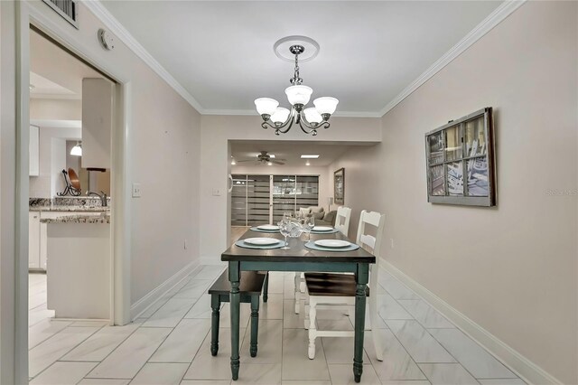 4175 Northmeadow Cir Unit 4175, Tampa, FL 33618 - dining room with a chandelier, ceiling fan, crown molding, and baseboards