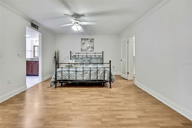 4175 Northmeadow Cir Unit 4175, Tampa, FL 33618 - bedroom featuring crown molding, light wood-type flooring, baseboards, ensuite bath, and a ceiling fan