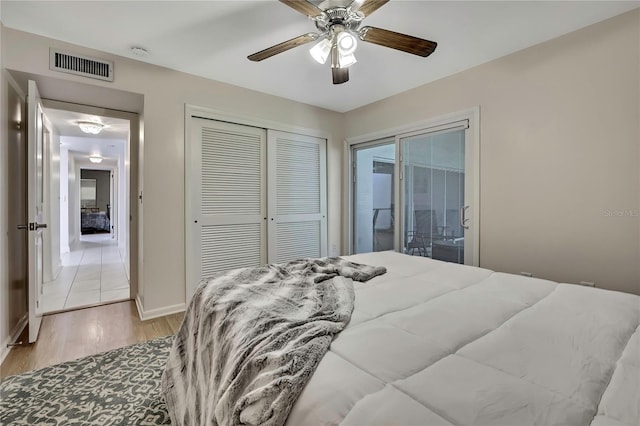 4175 Northmeadow Cir Unit 4175, Tampa, FL 33618 - bedroom featuring access to outside, light wood-type flooring, a closet, baseboards, and a ceiling fan