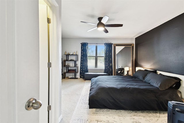 carpeted bedroom featuring a ceiling fan