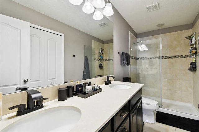 bathroom featuring visible vents, a sink, and a stall shower