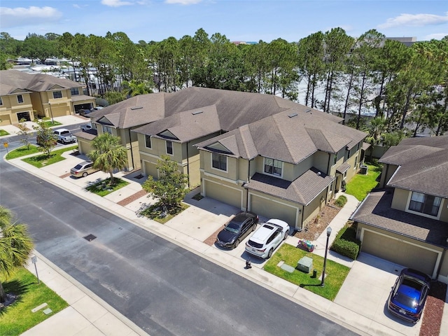 birds eye view of property with a residential view