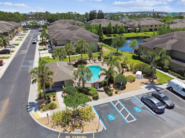 aerial view featuring a residential view and a water view