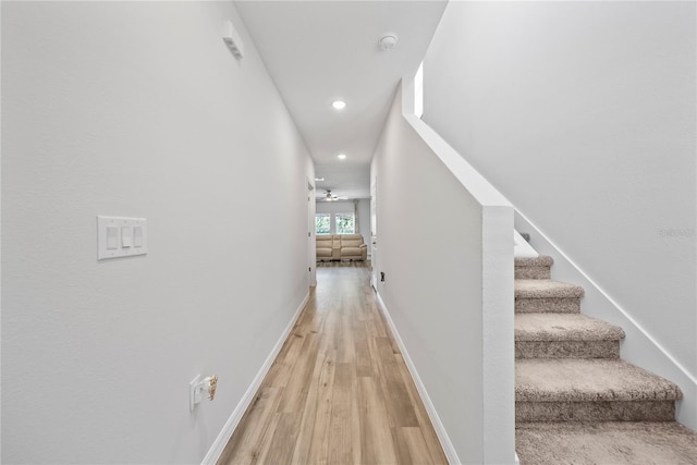 7797 Peace Lily Ave, Wesley Chapel, FL 33545 - corridor with baseboards, recessed lighting, stairway, and light wood finished floors