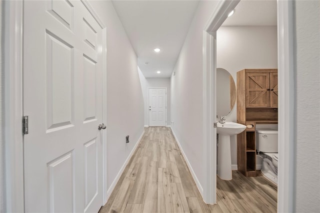7797 Peace Lily Ave, Wesley Chapel, FL 33545 - hallway featuring baseboards, recessed lighting, and light wood-style flooring