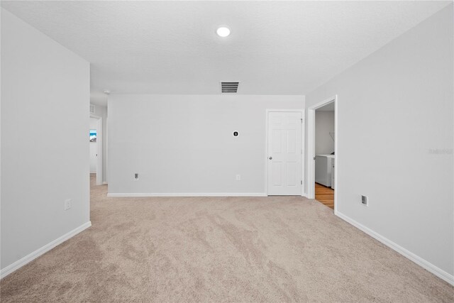 7797 Peace Lily Ave, Wesley Chapel, FL 33545 - carpeted empty room with recessed lighting, visible vents, washer / dryer, and baseboards