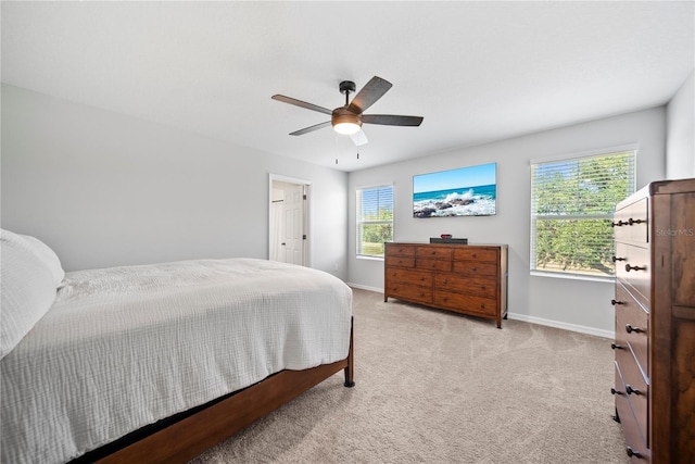 7797 Peace Lily Ave, Wesley Chapel, FL 33545 - bedroom with light colored carpet, a ceiling fan, and baseboards