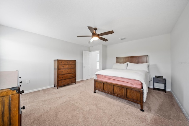 7797 Peace Lily Ave, Wesley Chapel, FL 33545 - bedroom featuring baseboards, visible vents, a ceiling fan, and light carpet