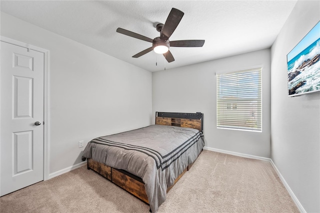 7797 Peace Lily Ave, Wesley Chapel, FL 33545 - bedroom with ceiling fan, baseboards, and carpet floors