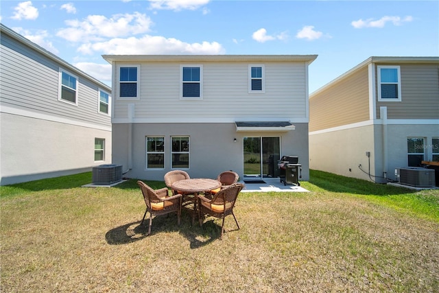 7797 Peace Lily Ave, Wesley Chapel, FL 33545 - back of house with a patio area, central AC unit, and a lawn