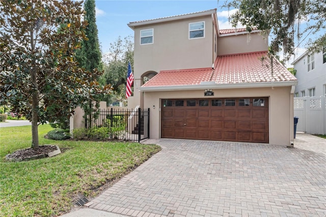 2701 W Bay Ave, Tampa, FL 33611 - mediterranean / spanish-style home with fence, a tiled roof, stucco siding, and a garage