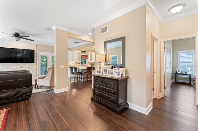 2701 W Bay Ave, Tampa, FL 33611 - hall with dark wood-type flooring, ornamental molding, baseboards, and plenty of natural light