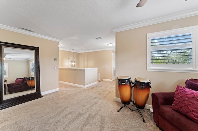 2701 W Bay Ave, Tampa, FL 33611 - living area with ceiling fan, ornamental molding, visible vents, and light colored carpet