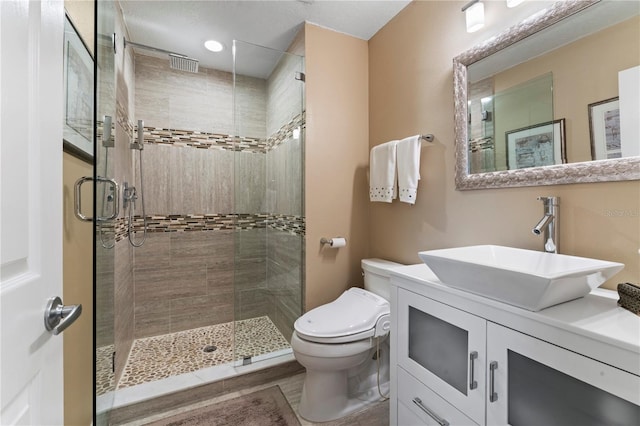 2701 W Bay Ave, Tampa, FL 33611 - bathroom with vanity, a stall shower, and toilet