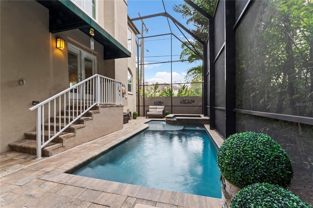 2701 W Bay Ave, Tampa, FL 33611 - view of pool featuring a patio, a lanai, and a pool with connected hot tub