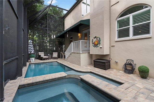 2701 W Bay Ave, Tampa, FL 33611 - view of pool featuring a lanai, a patio area, and a pool with connected hot tub