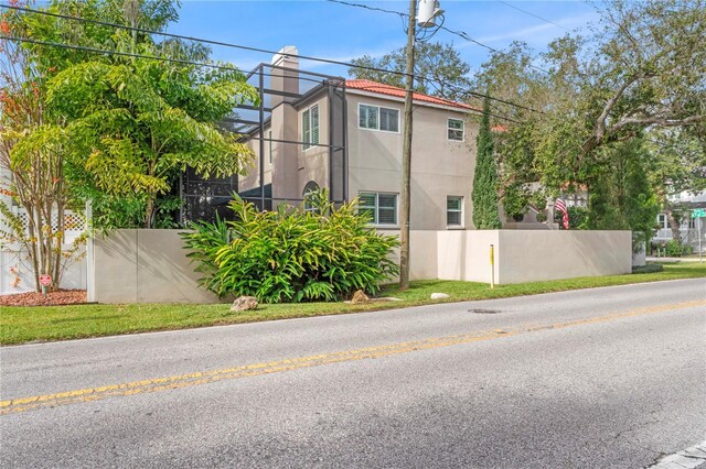 2701 W Bay Ave, Tampa, FL 33611 - view of property exterior featuring fence and stucco siding